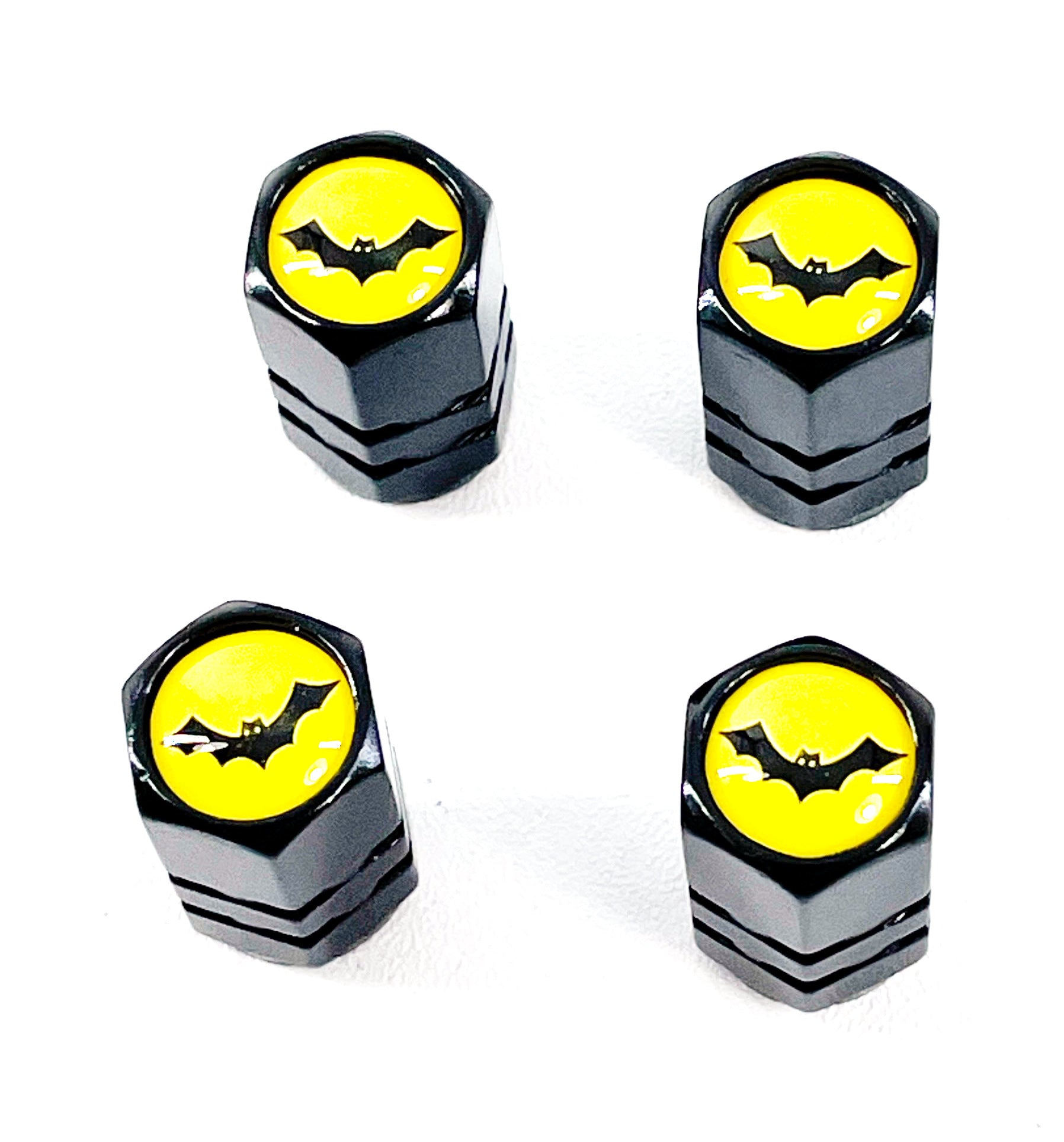 Set of 4 Black Anodized Aluminum Valve Stem Caps with Bat Logo on Yellow Background