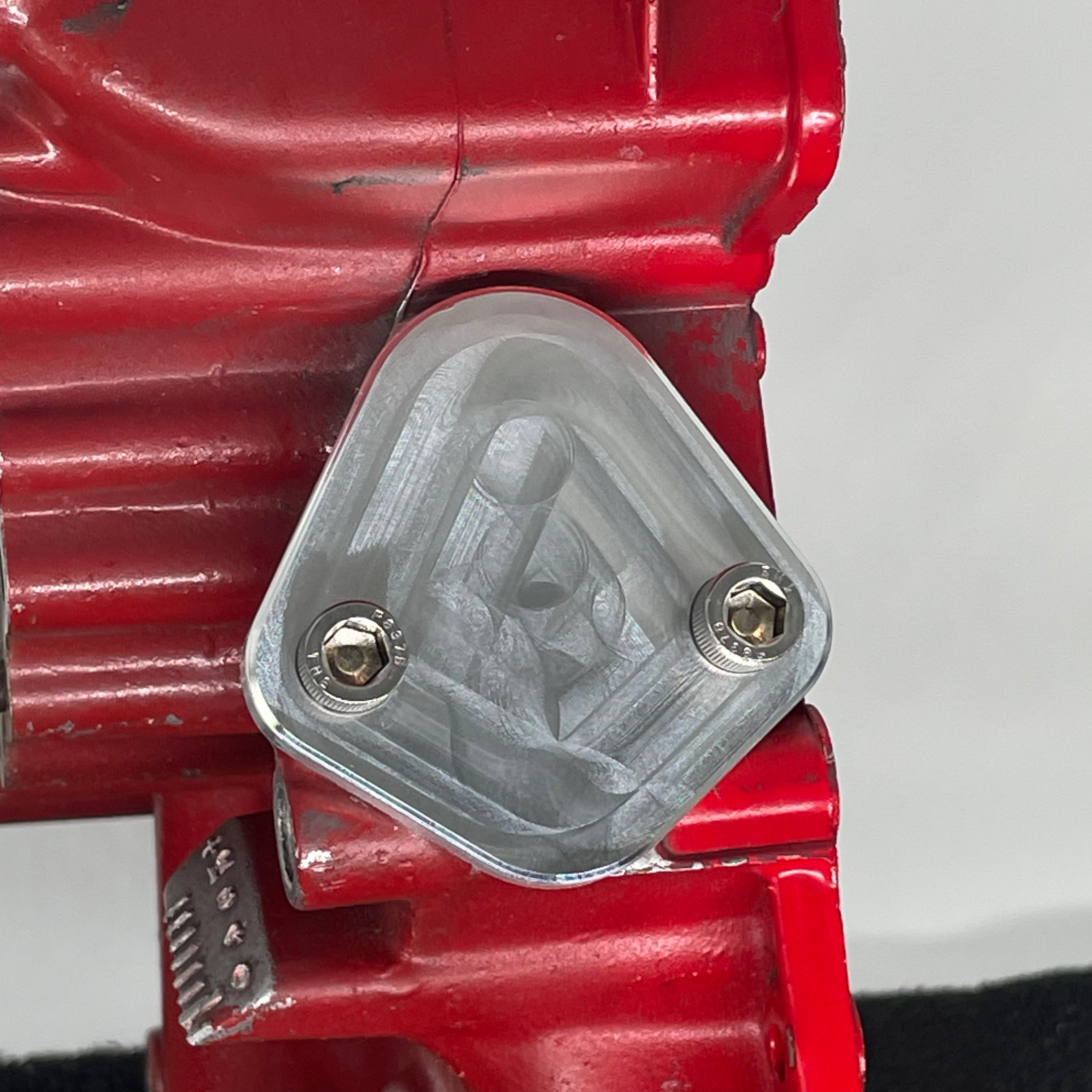 F158 Diamond Fuel Pump Block Off Plate installed on Buick V6 engine showing diamond pattern 5/16-18 mounting
