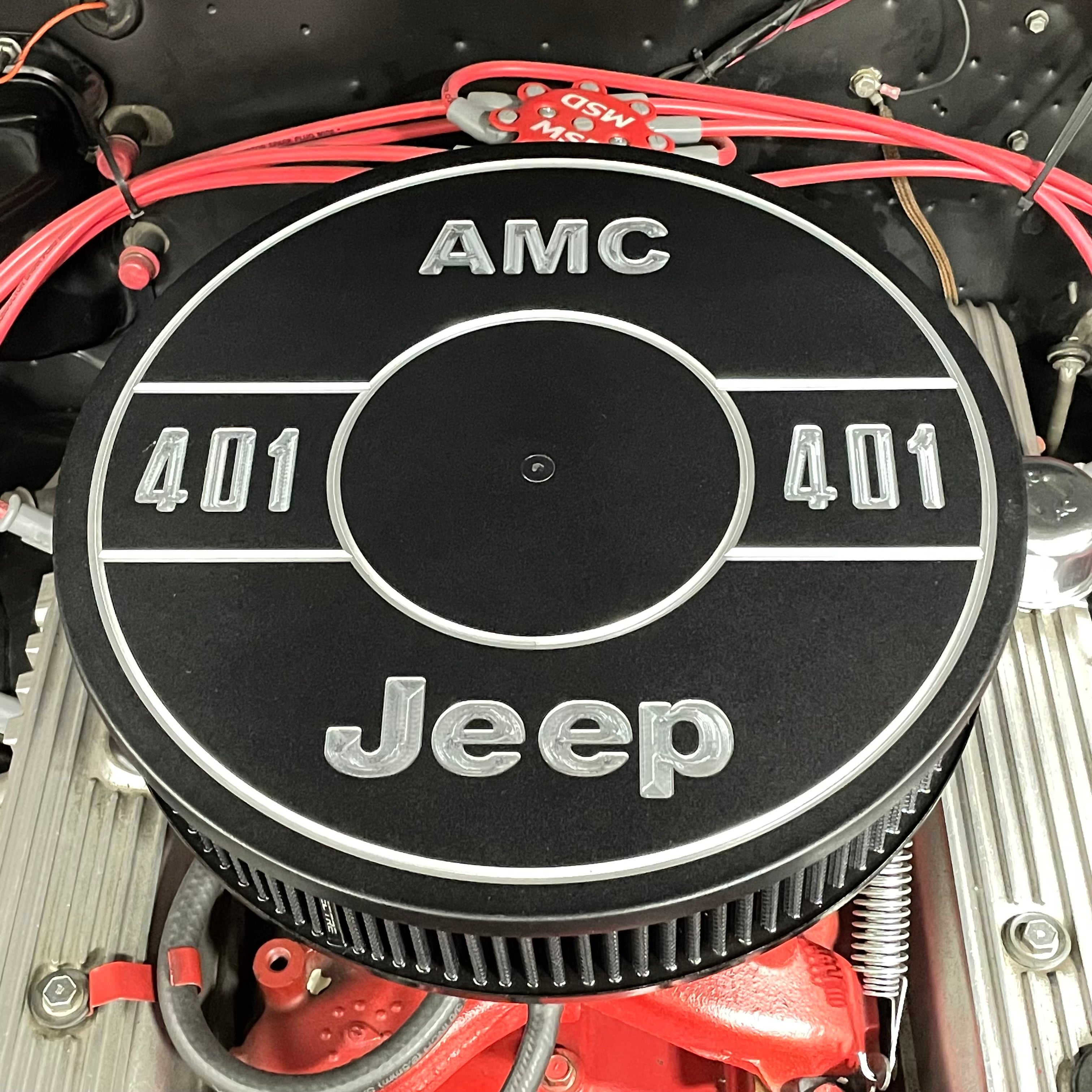 AMC 401 air cleaner lid installed on Jeep big block V8 engine showing custom flagship engraving